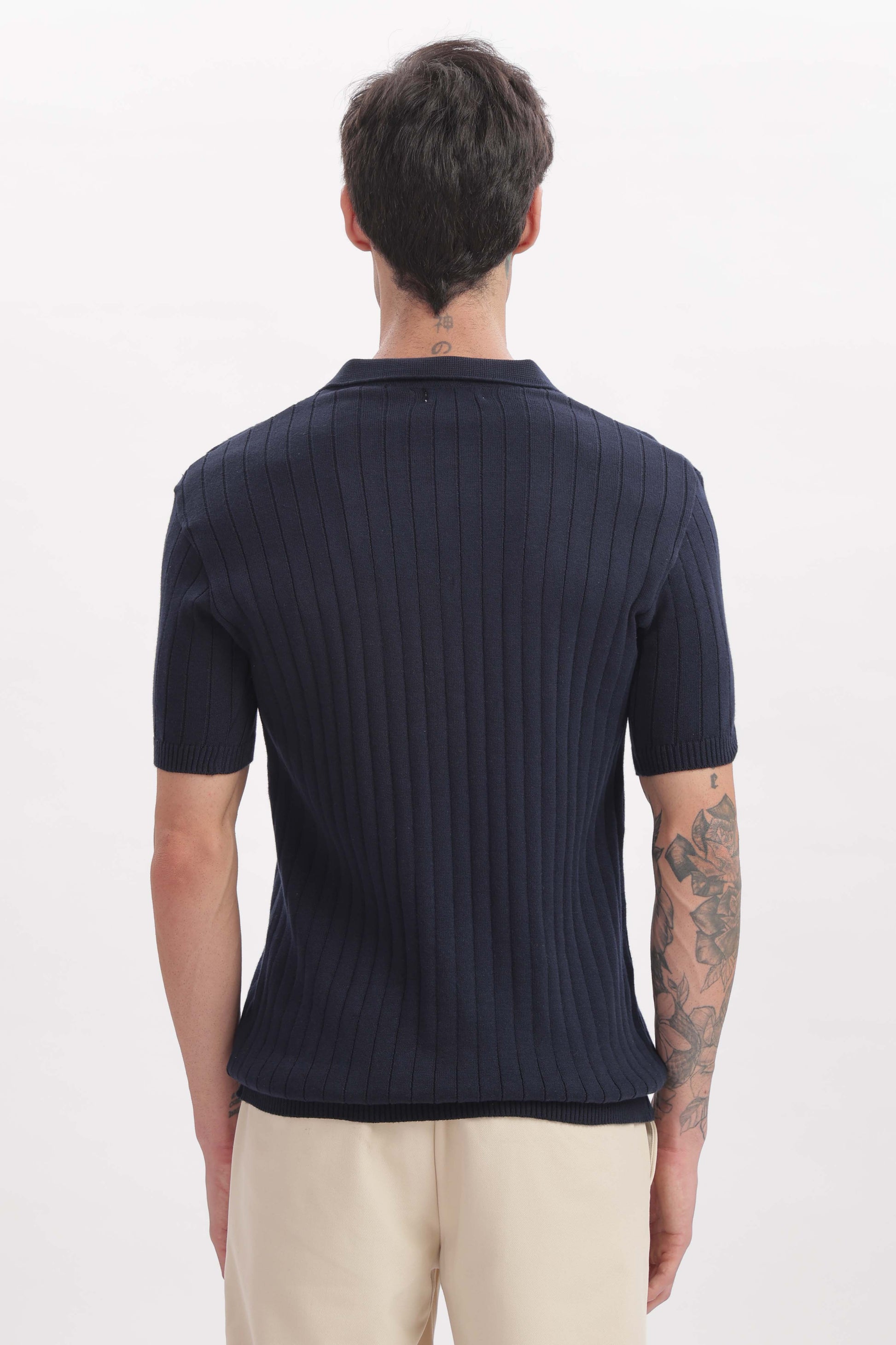 Back view of buttonless marine blue polo for men – timeless menswear by The Seasons