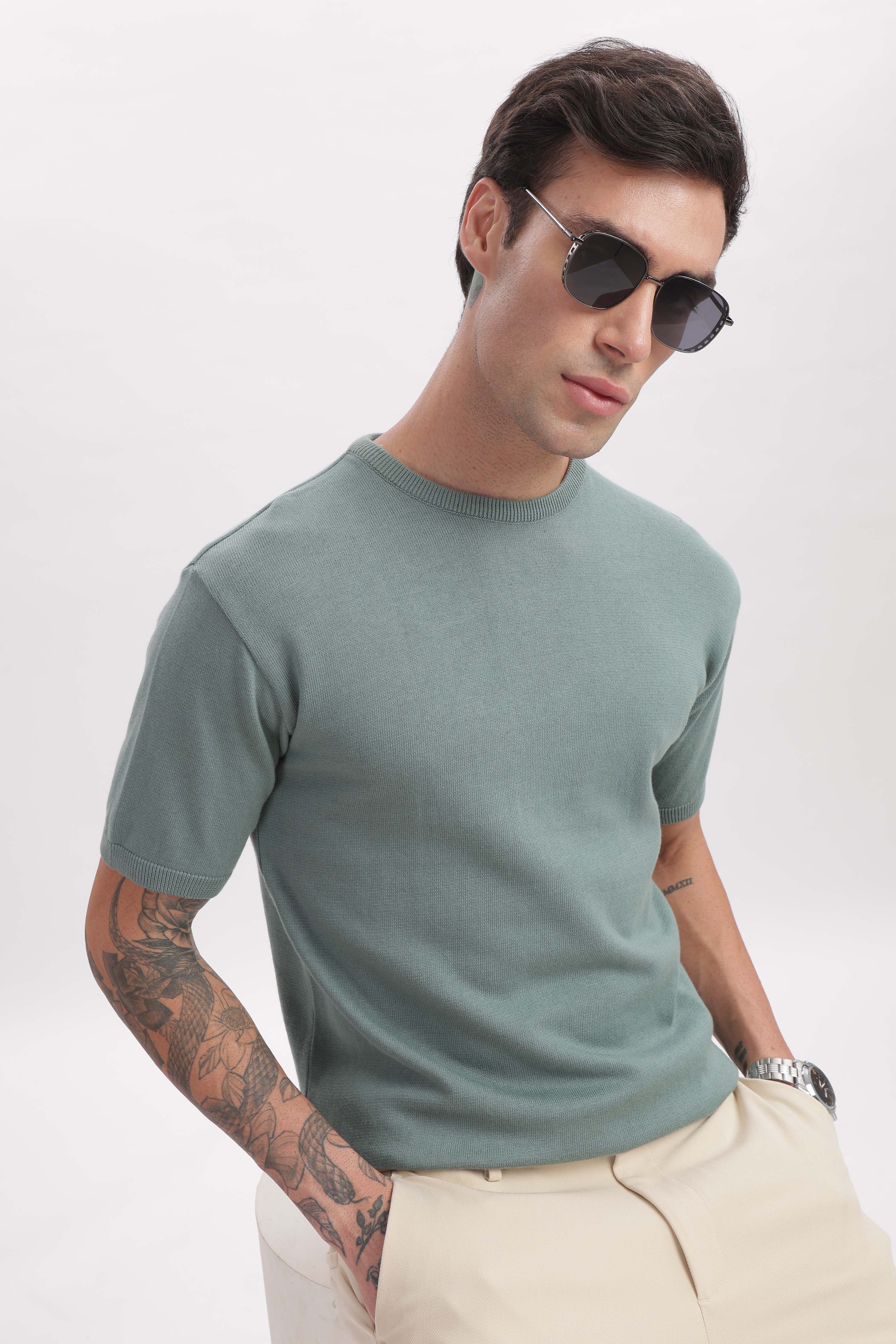 Model styling sage green half sleeves crewneck T-shirt – relaxed luxury by The Seasons