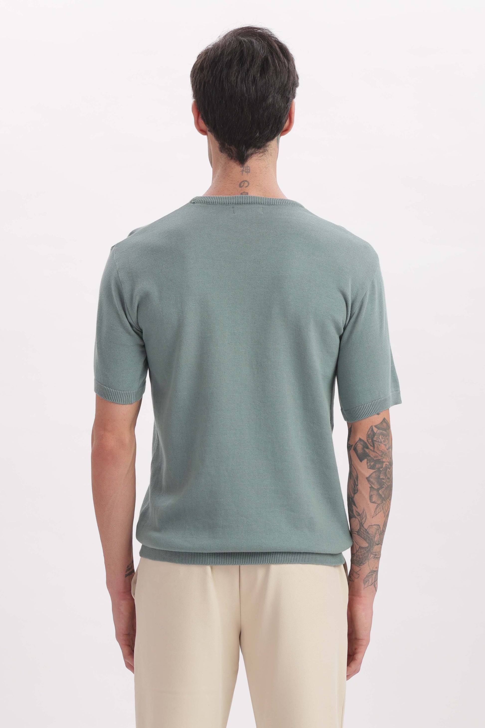 Back view of sage green crewneck T-shirt for men – soft minimal style by The Seasons